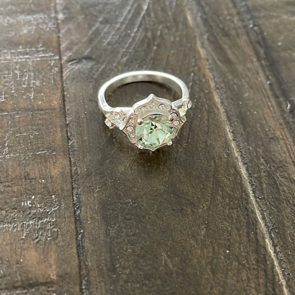 silver and light green ring